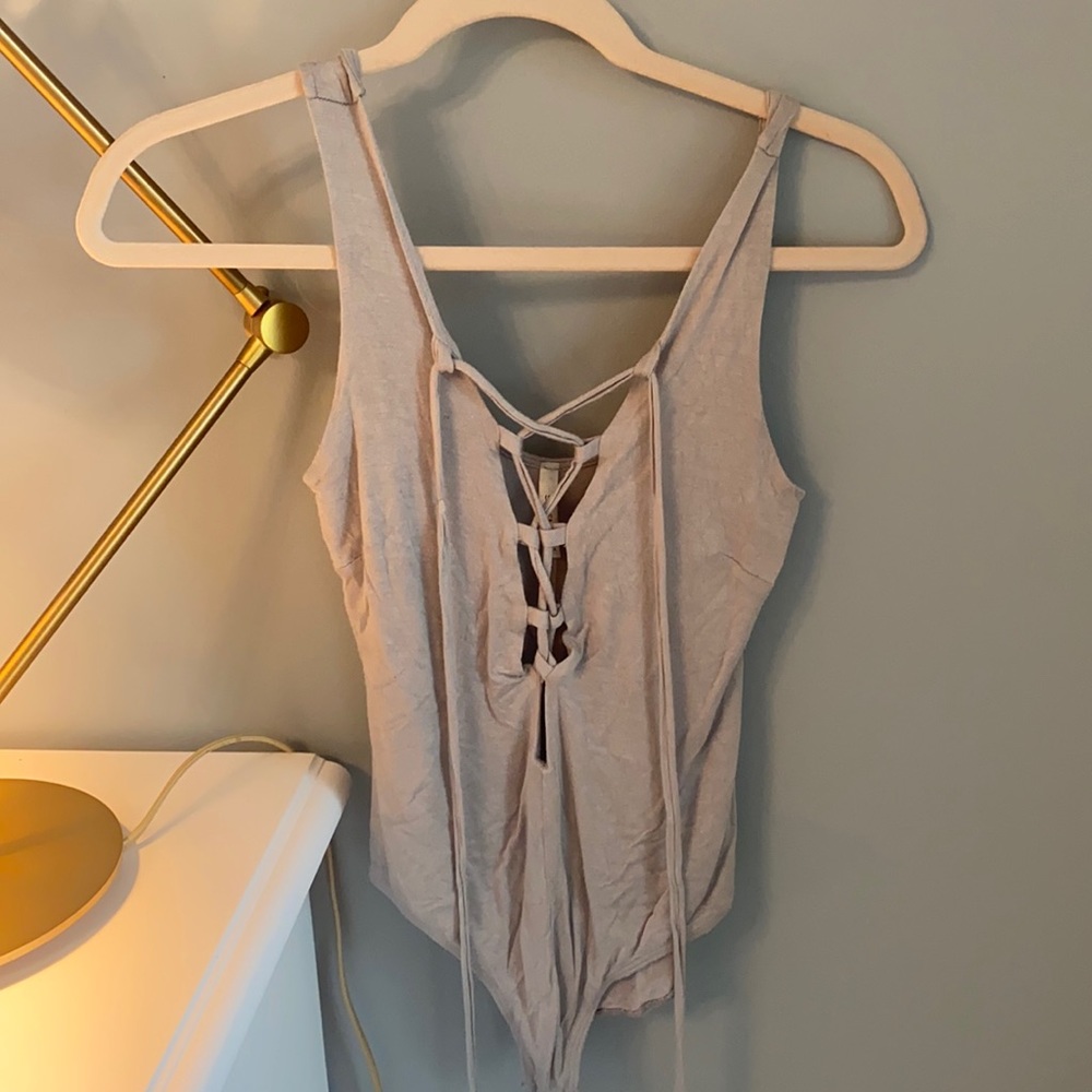 Light tan bodysuit with fun tie in front